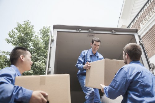 Professional movers loading furniture for removal services in Camden