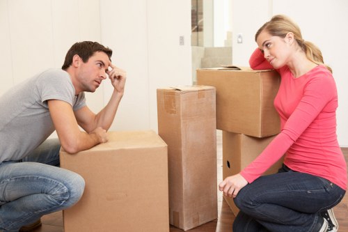 Packed office boxes and furniture ready for transport in Camden